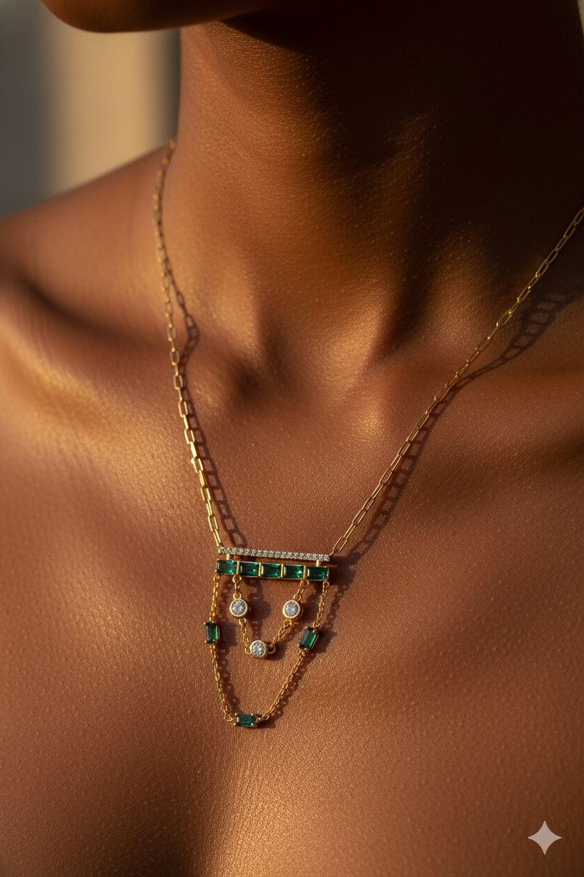 Model wearing gold layered green-stone necklace in warm editorial lighting – high-fashion luxury jewellery styling by Near Earth Object.
