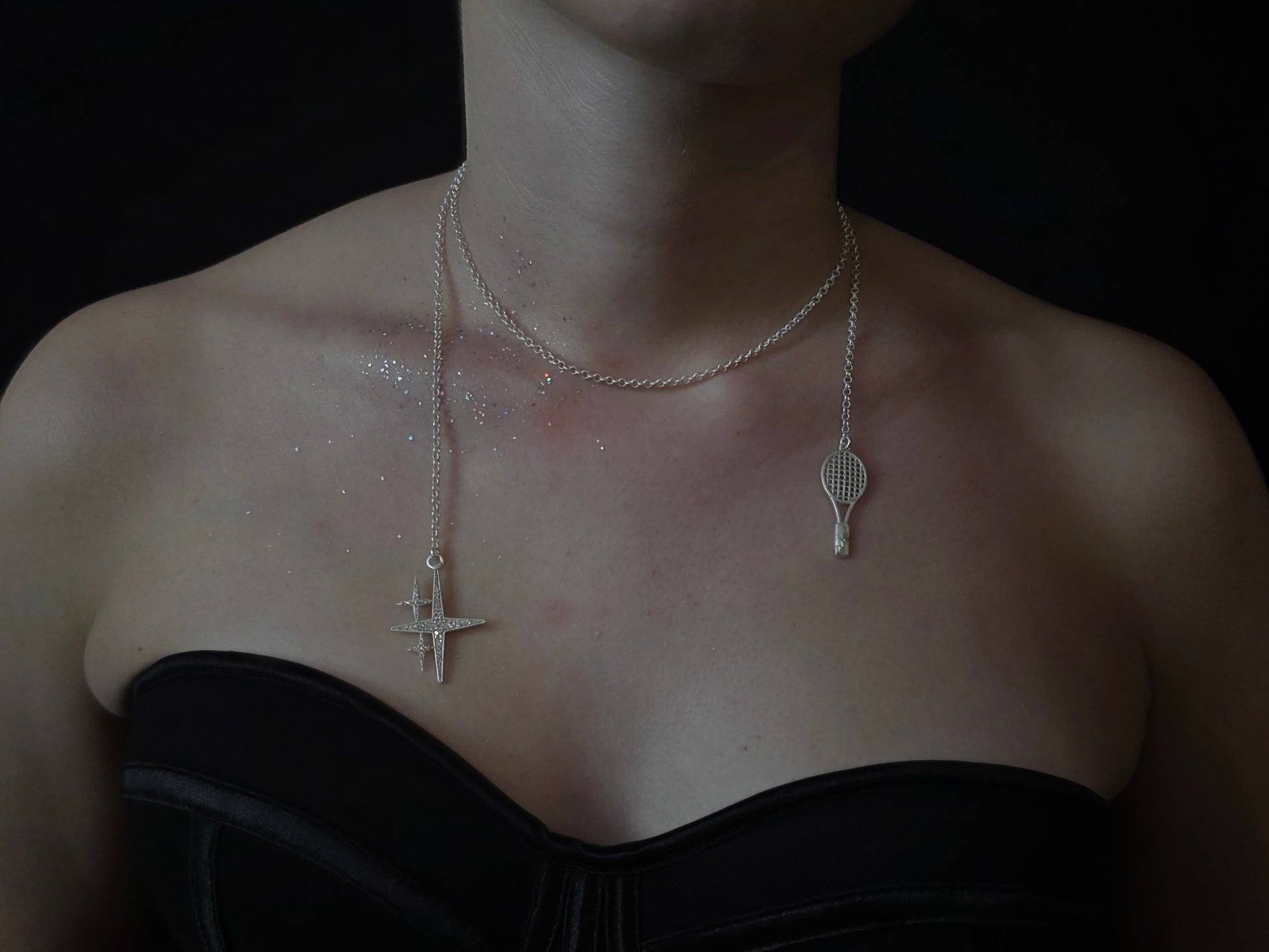 Near Earth Object | Silver necklaces with unique pendants on a dark background