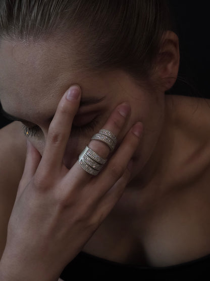 Near Earth Object Nova Stack Ring – silver multi-band pave crystal ring worn on middle finger