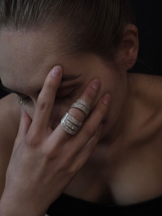 Near Earth Object Nova Stack Ring – silver multi-band pave crystal ring worn on middle finger