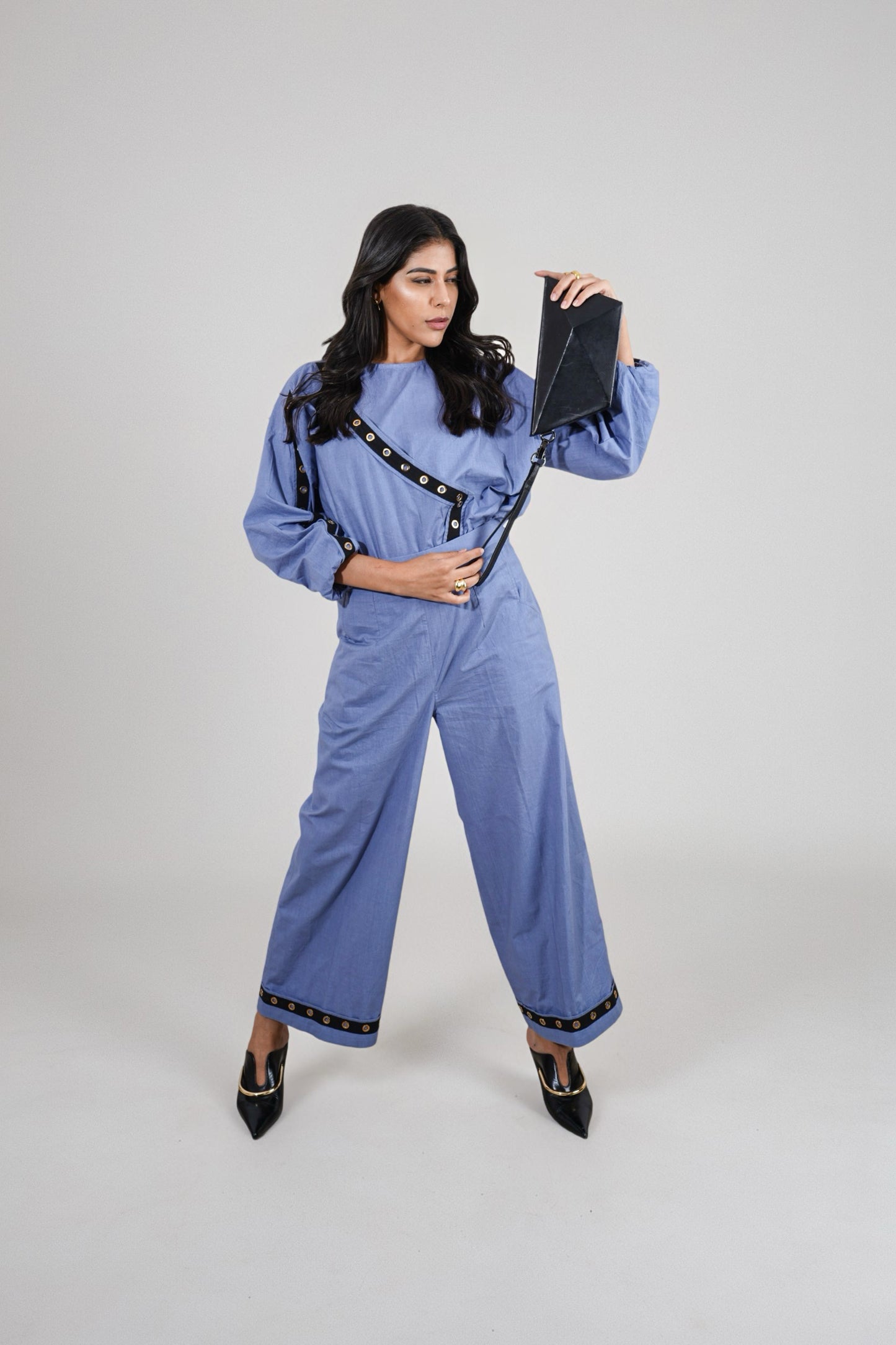 Woman wearing a blue trousers with black accents | Women's Pants | Bottoms | Pret Clothes | nEo Clothes.