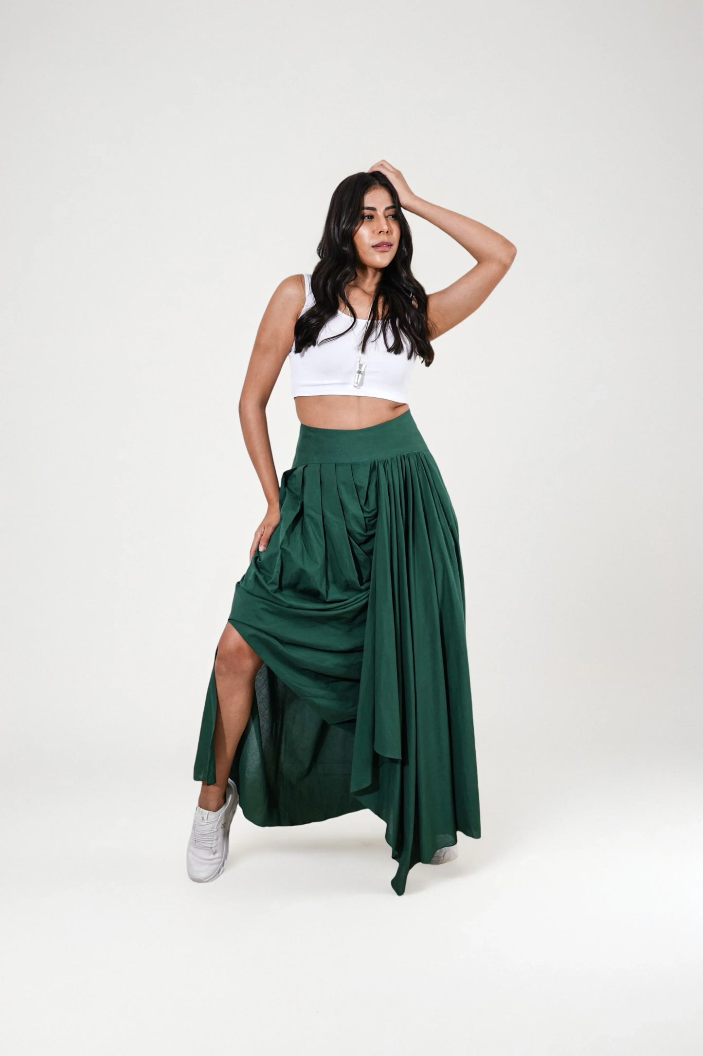 Woman wearing a white top and dark green skirt | Women's Skirt | Pret Clothes | nEo Clothes