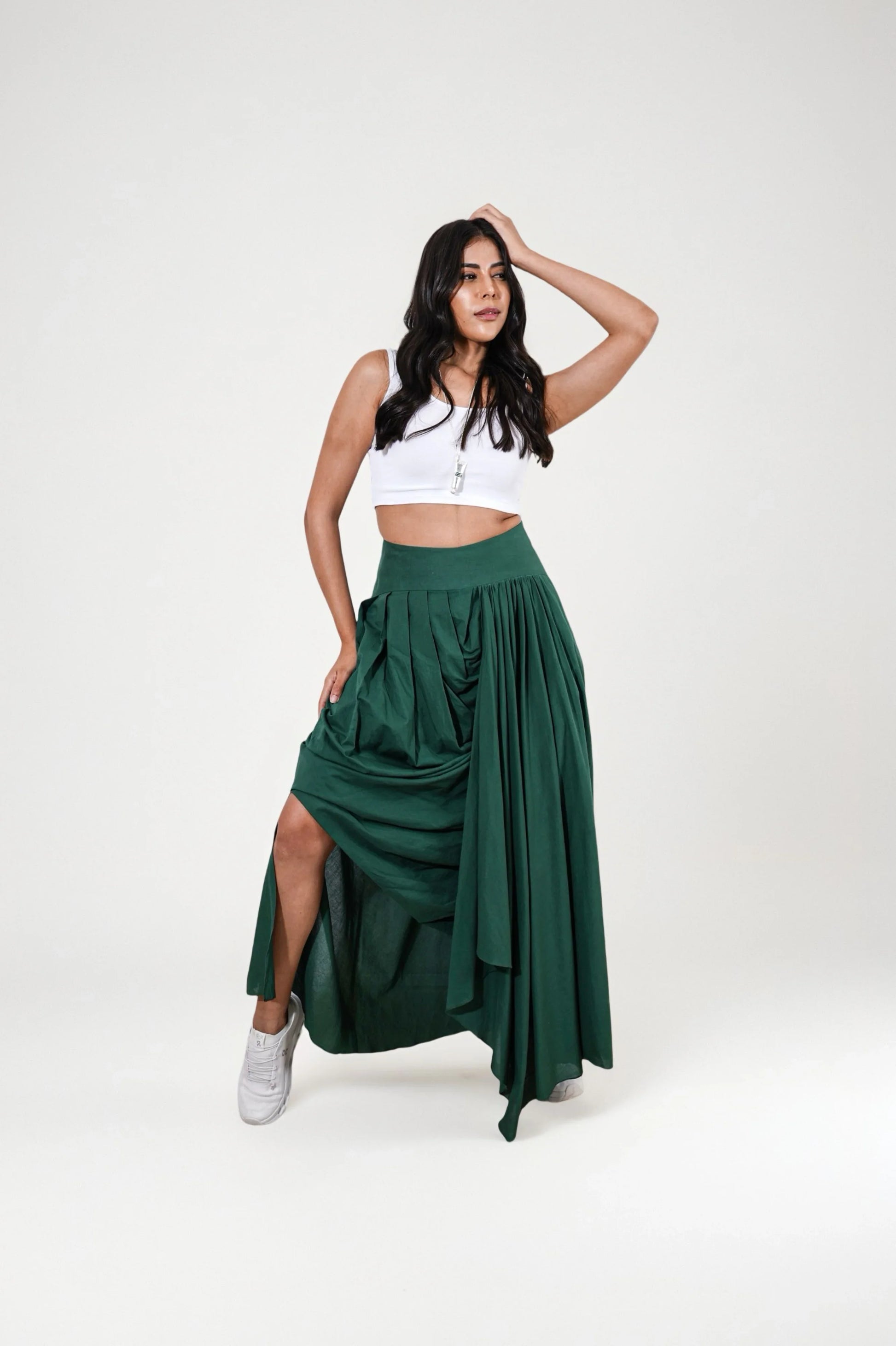 Woman wearing a white top and dark green skirt | Women's Skirt | Pret Clothes | nEo Clothes