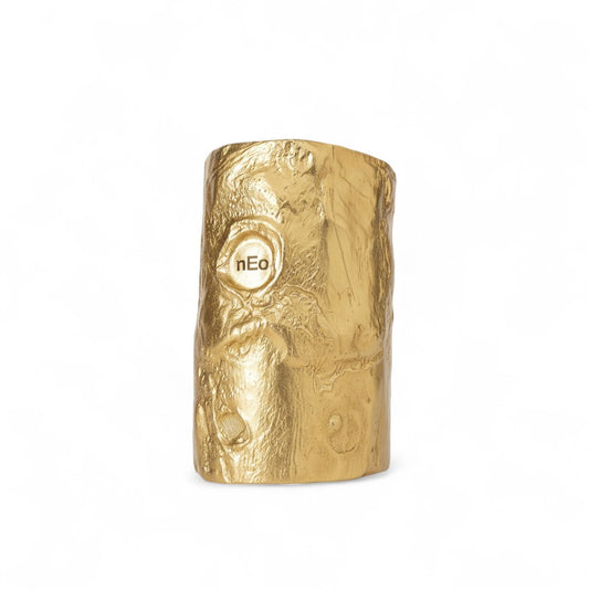 Gold sculptural cuff bracelet with crater-like cosmic texture and nEo engraving – statement jewellery by Near Earth Object.