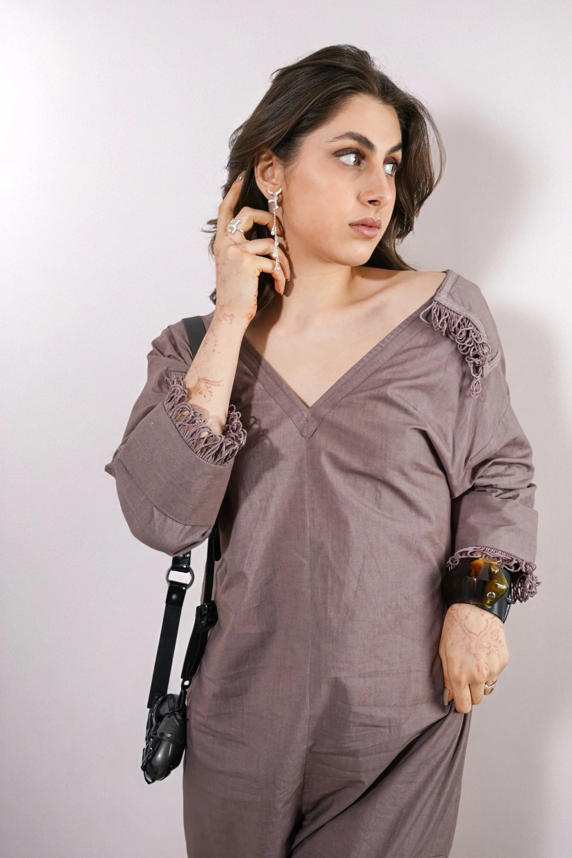 Woman wearing a Beige outfit with lace details, fashion jumpsuit for women casual chic look with sneakers | Women Jumpsuit | Pret Clothes | nEo Clothes.