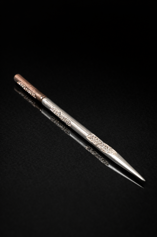 Near Earth Object | Decorative metal tool on a black background