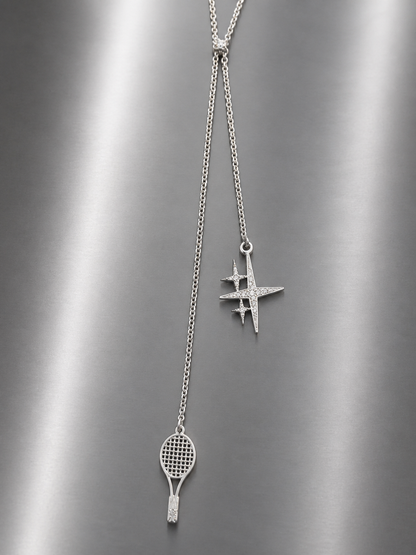 Near Earth Object | Silver necklace with tennis racket and hashtag pendant on a gray background