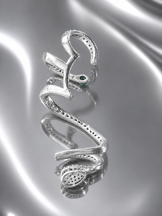 Near Earth Object | Silver snake-shaped pendant on a reflective silver surface