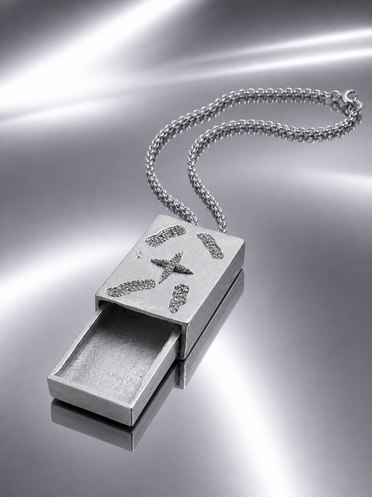 Near Earth Object | pendant with a star design on a reflective surface