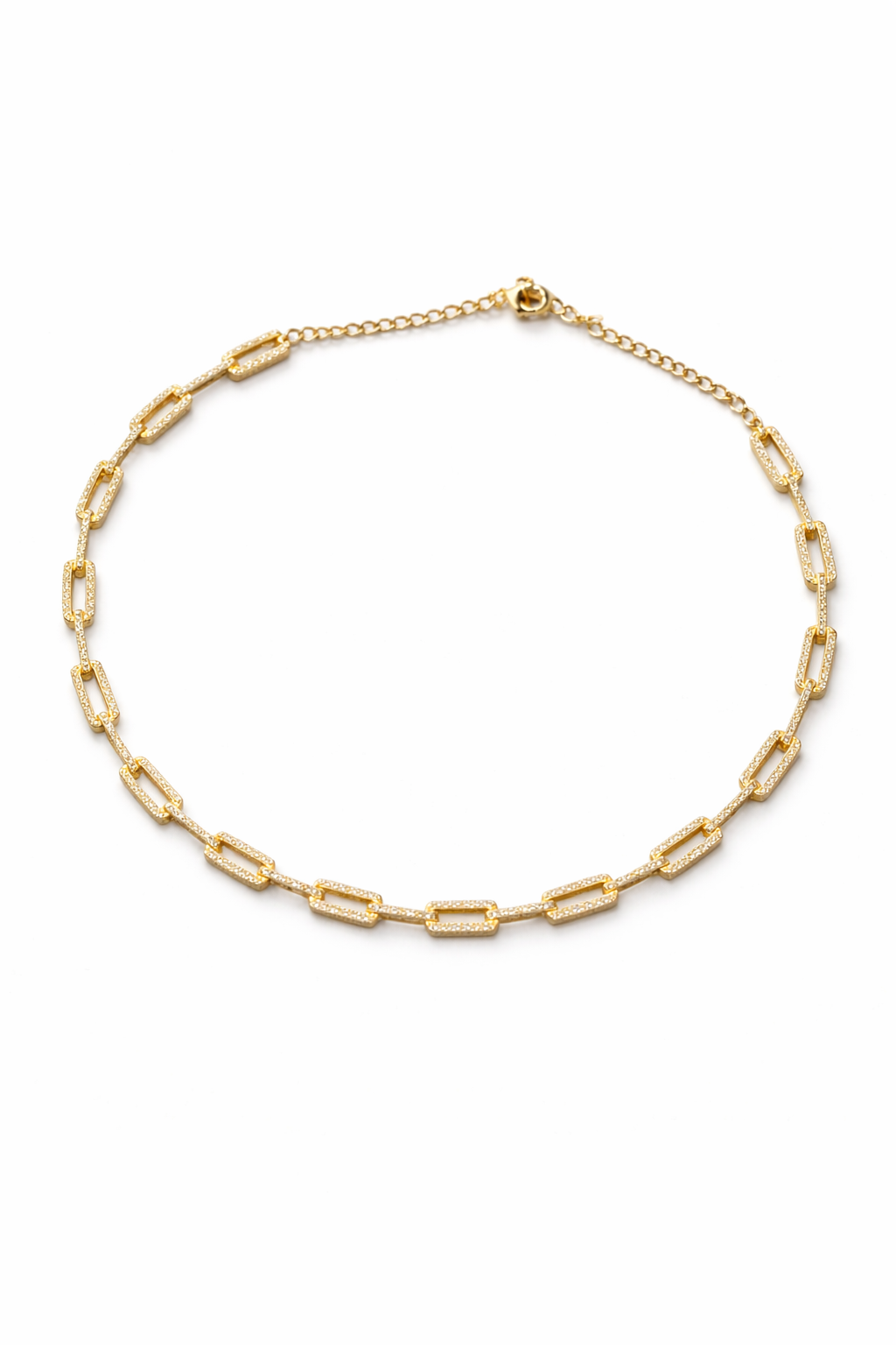Near Earth Object | Gold chain necklace on a white background