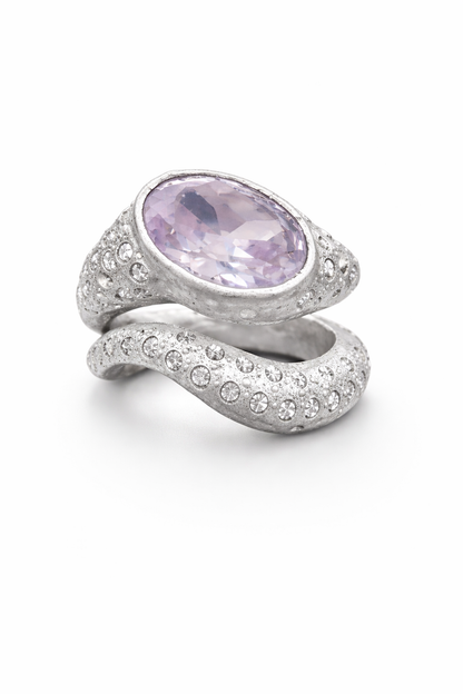 Near Earth Object | Silver ring with a pink gemstone on a white background