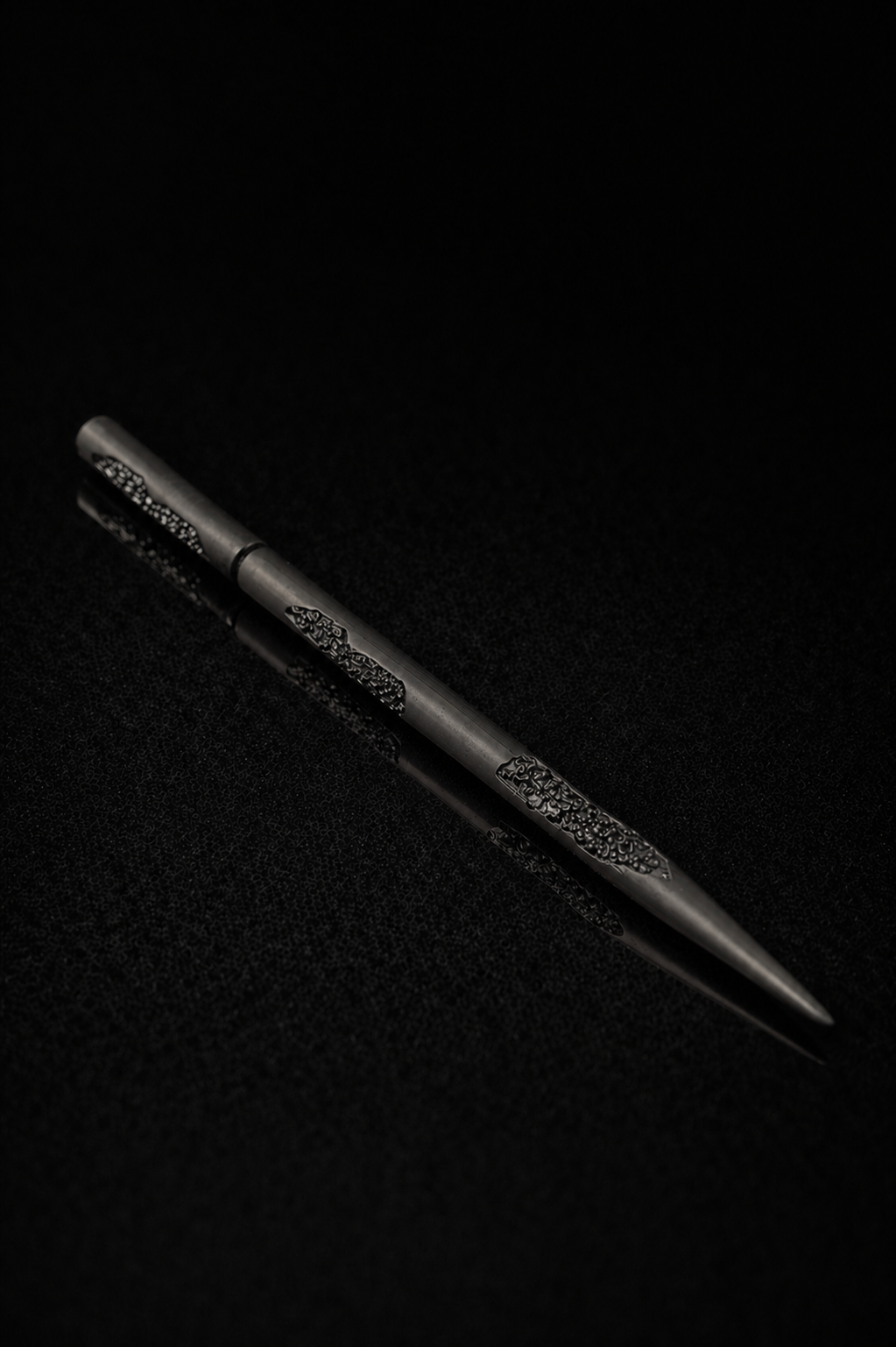 Near Earth Object | Black pen with decorative elements on a dark textured background