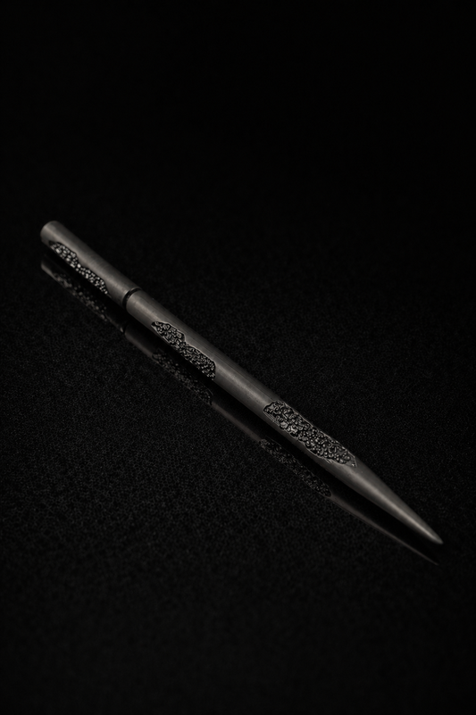 Near Earth Object | Black pen with decorative elements on a dark textured background