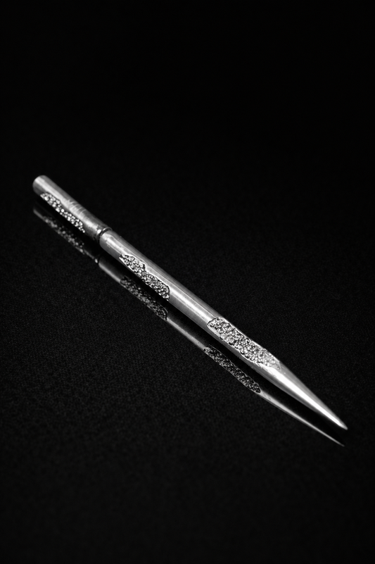Near Earth Object | Silver tweezers on a black background