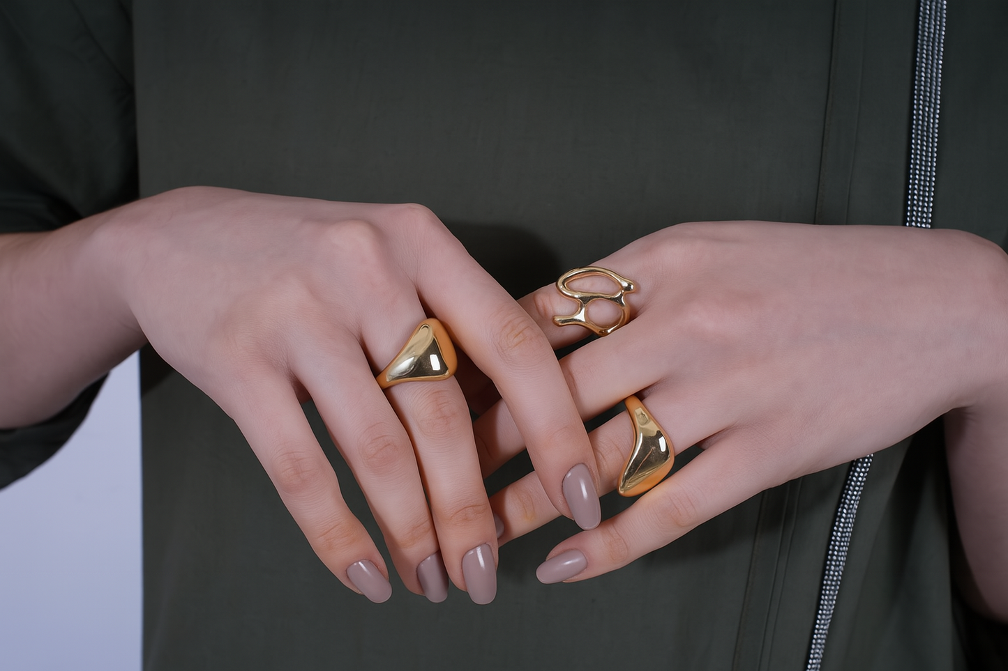 Close-up of hands wearing gold rings | Statement Ring | Asymmetrical Ring  | neo jewelry 