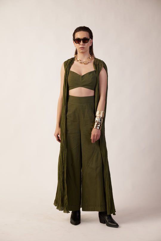 Cosmic Moss Overlay and Camisole : Woman wearing a military green outfit with a camisole and long pant near Earth object | Women's Overlay & Camisole | Jacket | Pret Clothes | nEo Clothes.