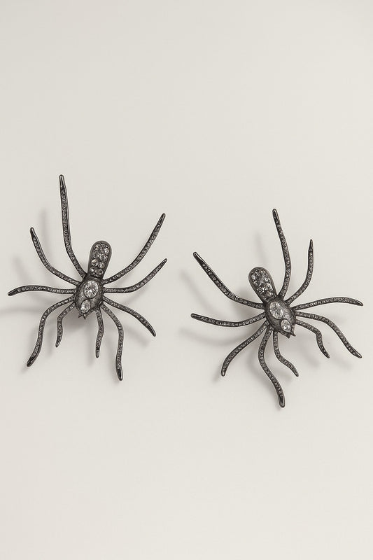 Black spider-shaped statement earrings with crystal detailing.