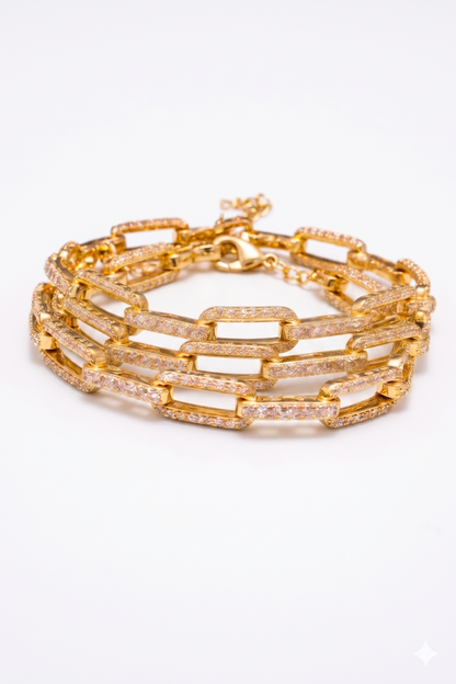Near Earth Object | Gold chain bracelet with clear stones on a white background