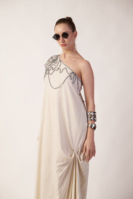 Ivory Wave : Woman wearing a one-shoulder dress with intricate detailing near Earth object | Women Dresses | Pret Clothes | nEo Clothes.