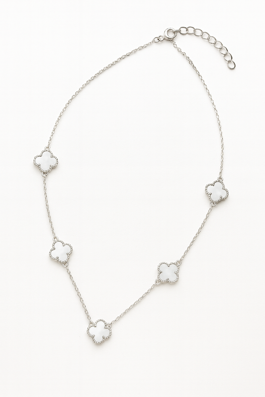 Silver geometric motif necklace with evenly spaced square-cut charms on a delicate chain – minimal modern jewellery by Near Earth Object.