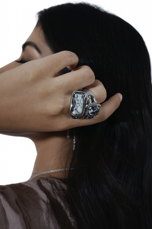 Model wearing silver sculptural ring with futuristic styling – luxury avant-garde jewellery by Near Earth Object.