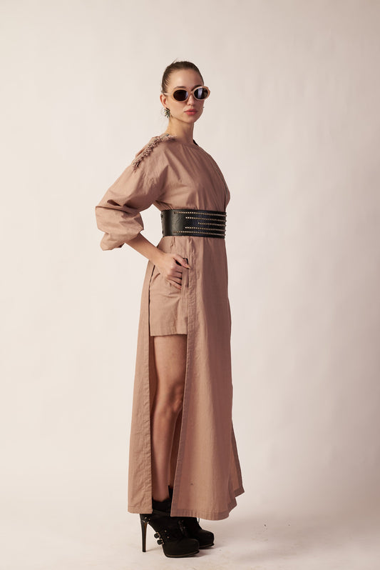 Lunar Trail Set :  Woman wearing a long beige dress with a belt - near Earth object 