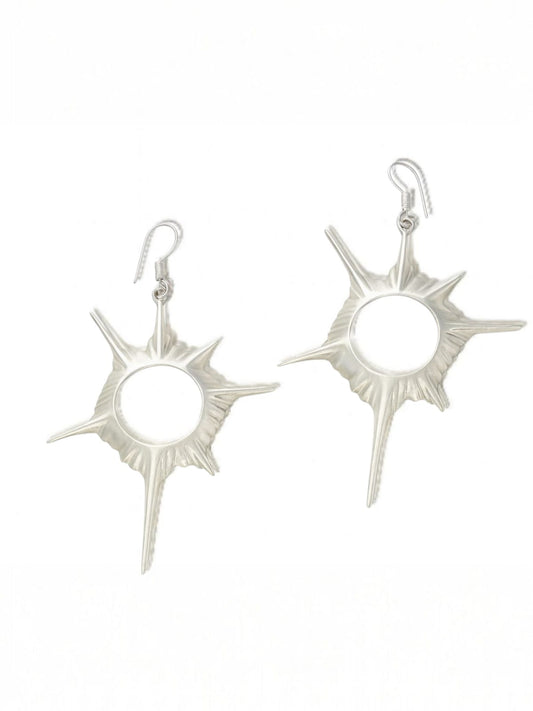 Silver spiked sunburst earrings with sculptural circular form – cosmic statement jewellery by Near Earth Object.