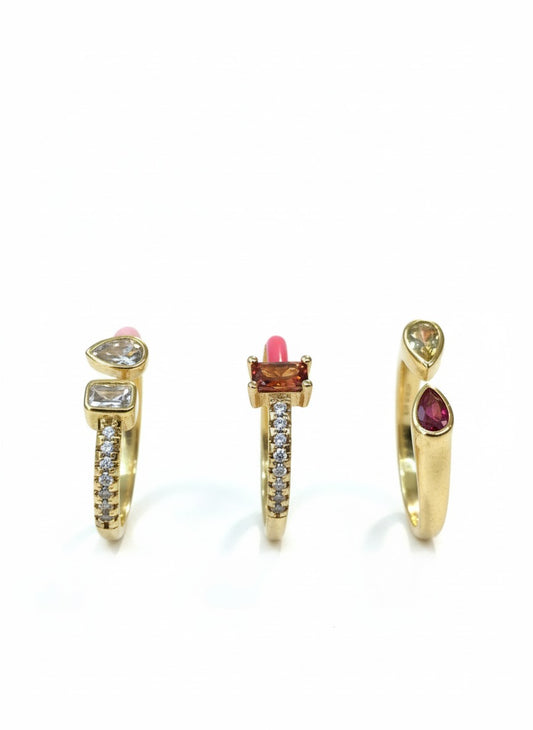 Gold dainty gemstone rings in mixed-cut designs, featuring heart, baguette, and teardrop stones with pavé detailing — elegant stackable statement rings by Near Earth Object.