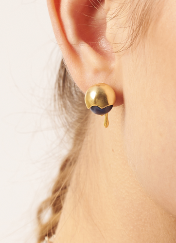 Gold earring with a black accent worn by a person | Statement Earring | neo jewelry