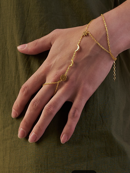 Gold hand chain bracelet on a hand  | Statement Necklace & Chokers  | neo jewelry 