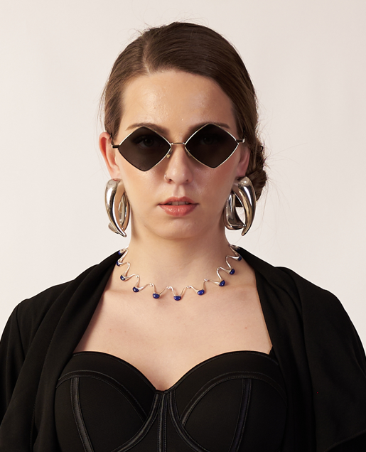 Woman wearing black sunglasses, a black top, and hoop earrings with Silver Necklace  | Statement Necklace & Chokers  | neo jewelry 