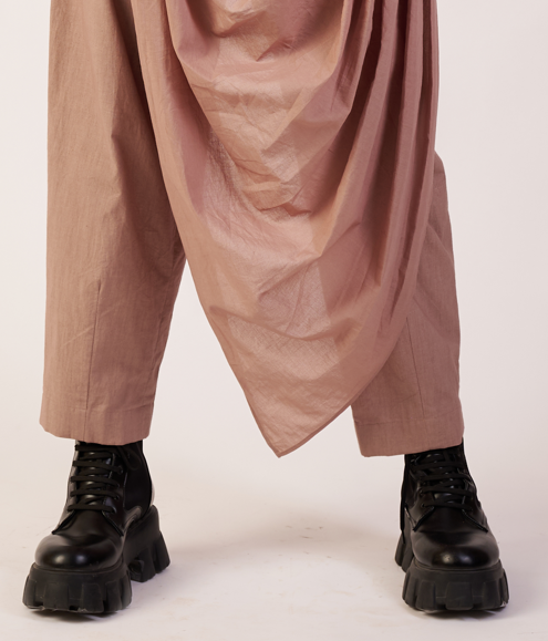 Person wearing beige draped design pants and black boots  | Women's Pants | Bottoms | Pret Clothes | nEo Clothes.