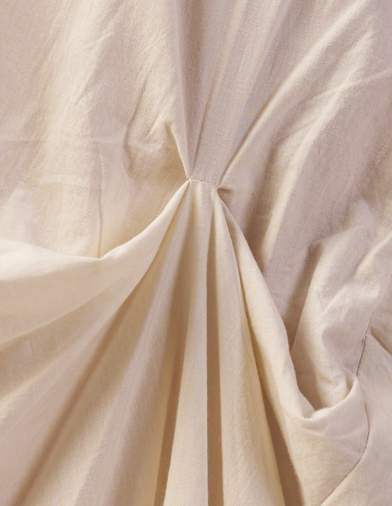 Close-up of beige fabric with folds  | Women Dresses | Pret Clothes | nEo Clothes.