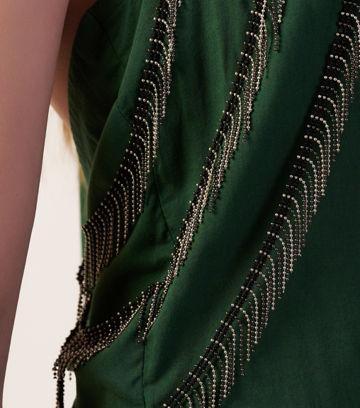 Close-up of a dark green garment with intricate beading details.  | Women Dresses | Pret Clothes | nEo Clothes.