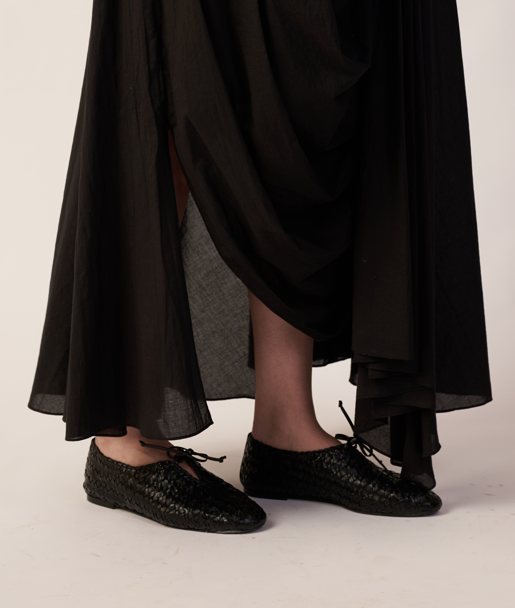 Person wearing a black pant and black shoes  | Women's Pants | Bottoms | Pret Clothes | nEo Clothes.
