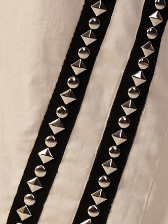 Close-up of a black belt with pyramid-shaped silver studs  | Women Jumpsuit | Pret Clothes | nEo Clothes.