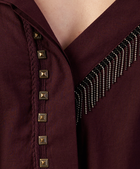 Close-up of a burgundy garment with decorative buttons and trim.  | Women Dresses | Pret Clothes | nEo Clothes.