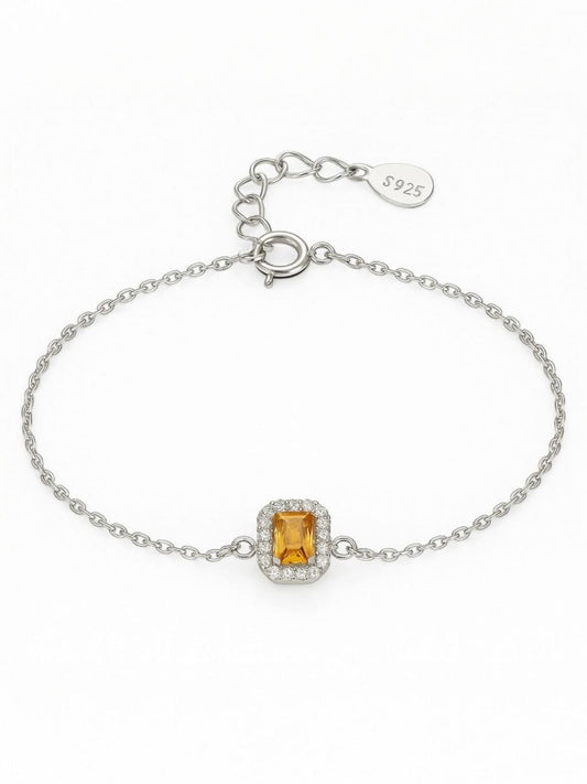 Silver minimalist bracelet with emerald-cut yellow gemstone framed by pavé crystals – elegant everyday jewellery by Near Earth Object.