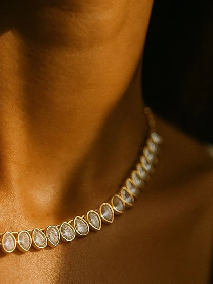 Golden Choker with Gemstone on the model neck.
