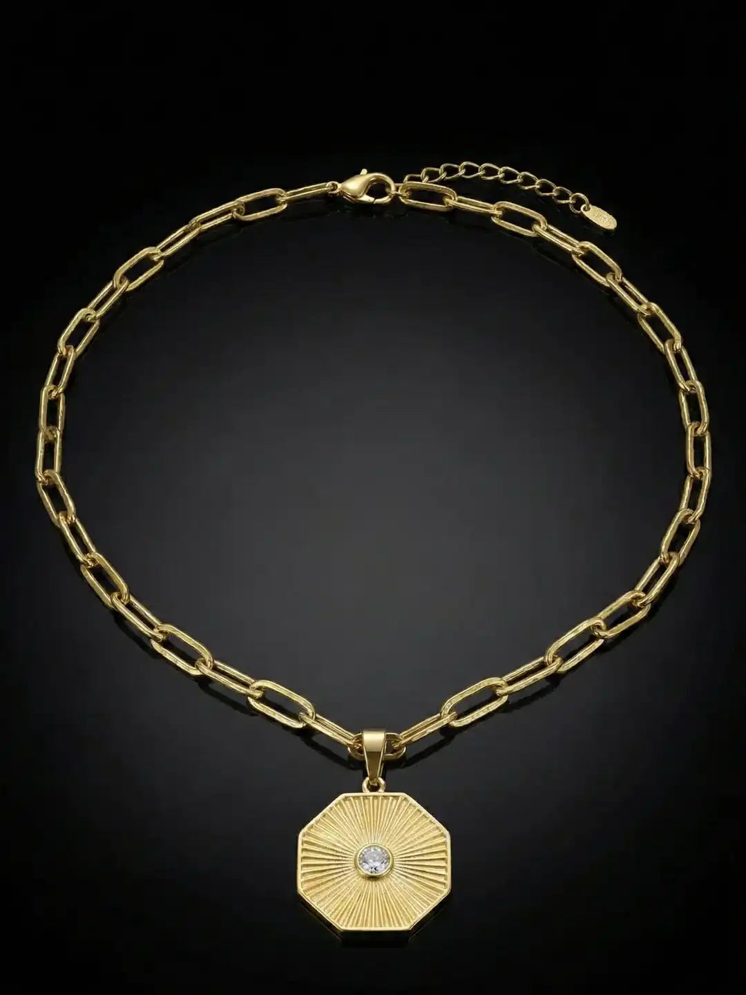 Gold Plated necklace with a hexagonal pendant.