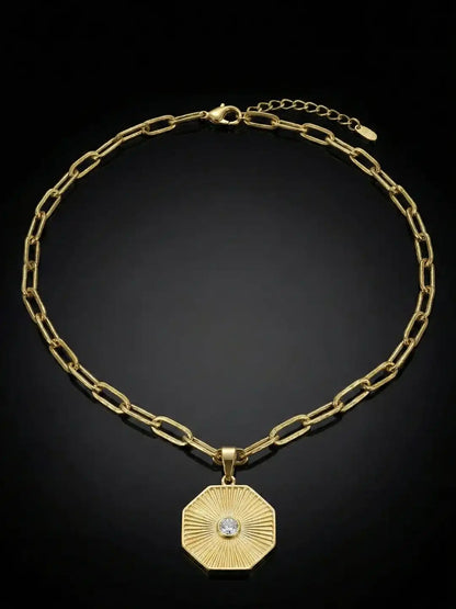 Gold Plated necklace with a hexagonal pendant.