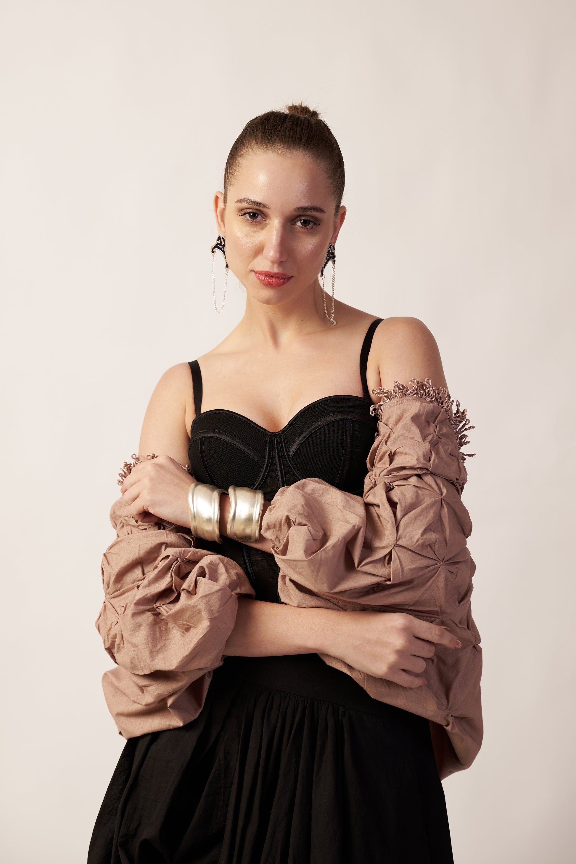 Terra Nova Shrug : Woman wearing a black top and beige oversized shrug - near Earth object | Women's Shrug | Jacket | Pret Clothes | nEo Clothes.