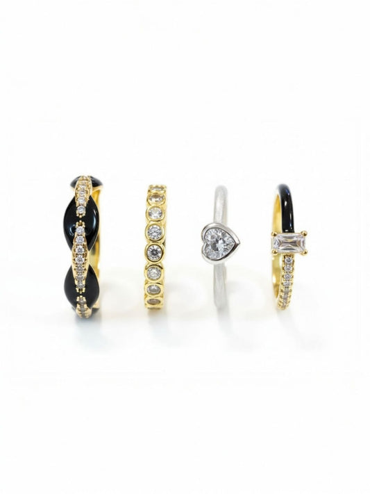 Set of four mixed-metal gold and silver rings featuring enamel, crystals, and geometric detailing – premium ring stack by Near Earth Object.