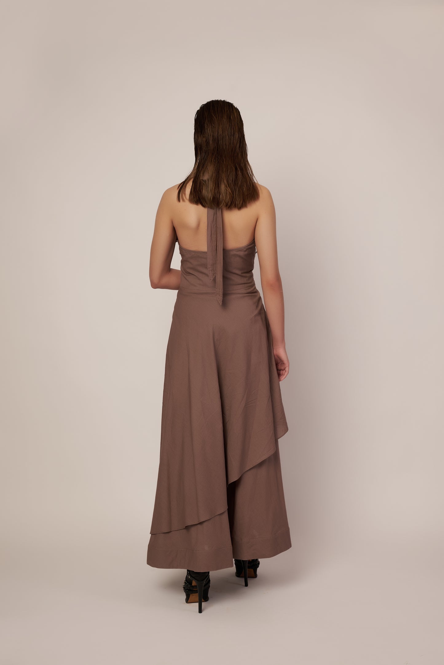 Woman wearing a beige halter neck dress | Women Dresses | Pret Clothes | nEo Clothes.