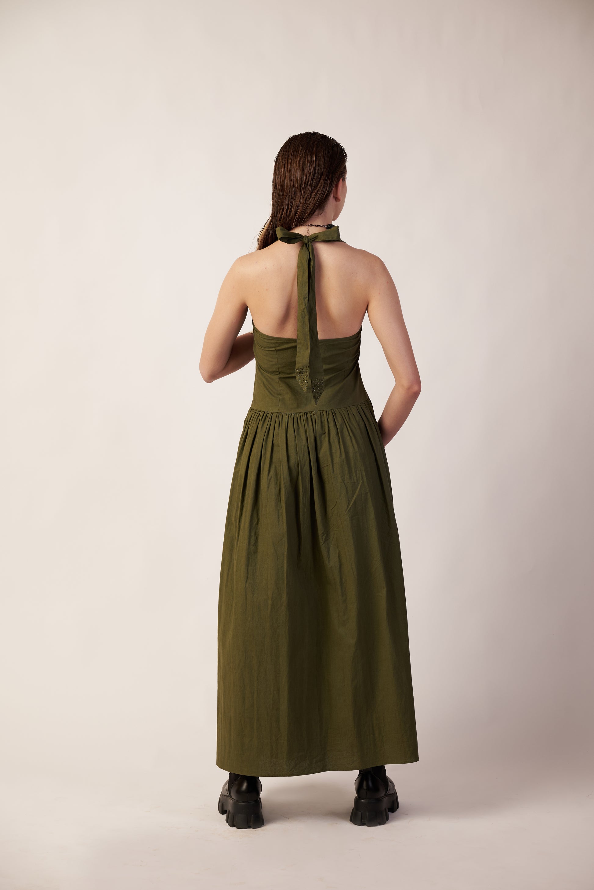 Woman wearing a Military green dress standing  | Women Dresses | Pret Clothes | nEo Clothes.