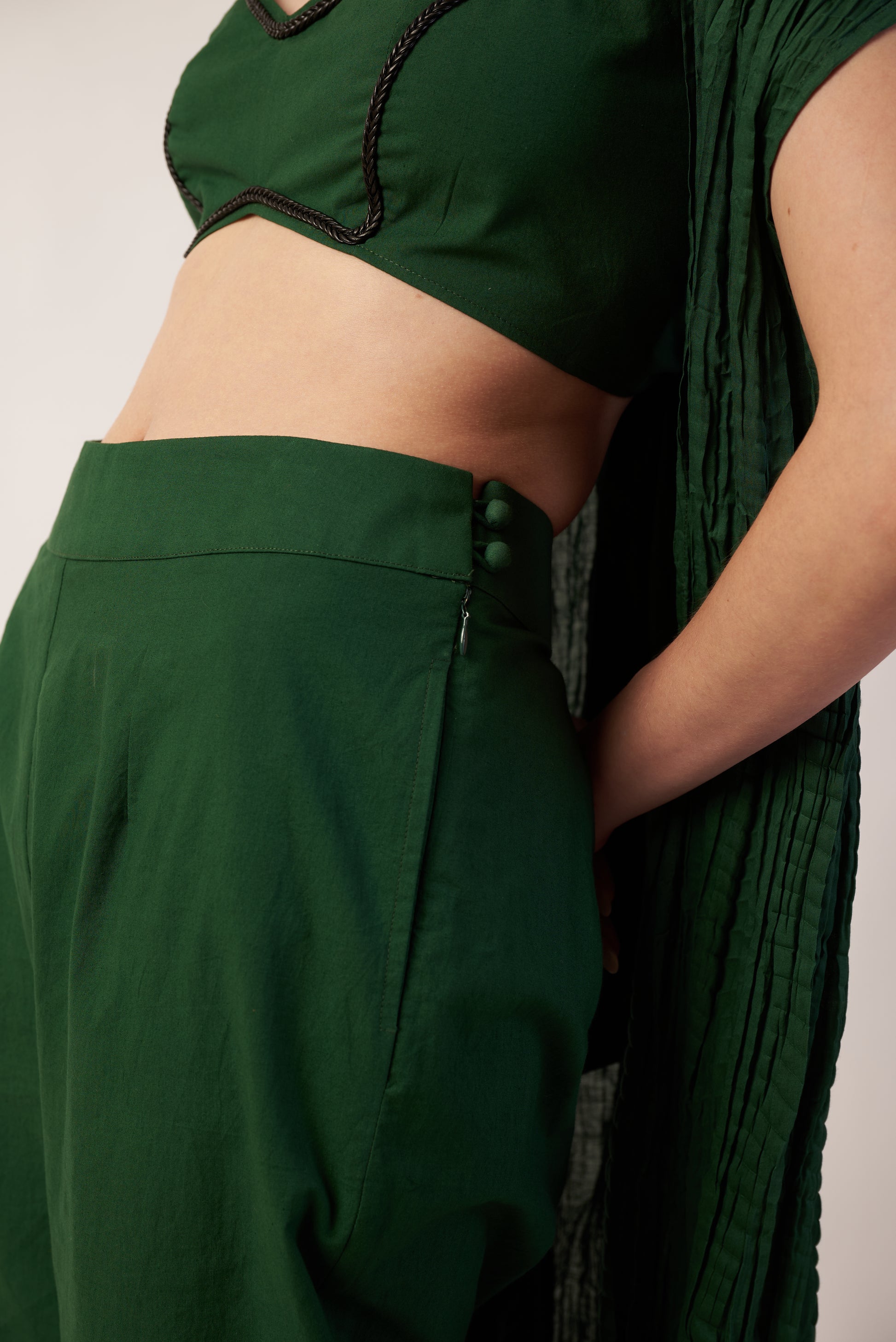Person wearing a dark green pant with camisole| Women's Pants | Bottoms & camisole | Pret Clothes | nEo Clothes.