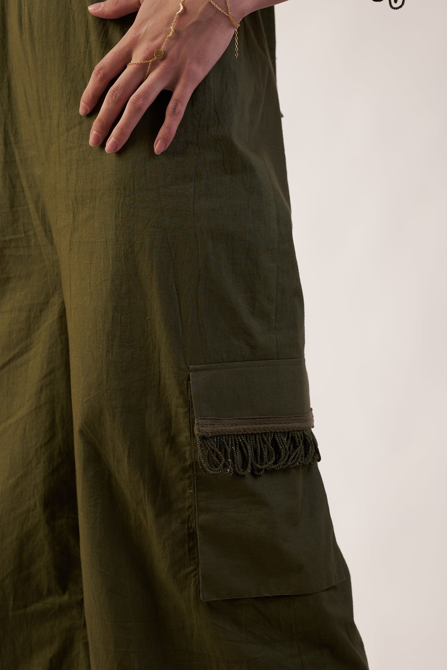 Close-up of olive green pants with a pocket detail  | Women Jumpsuit | Pret Clothes | nEo Clothes.