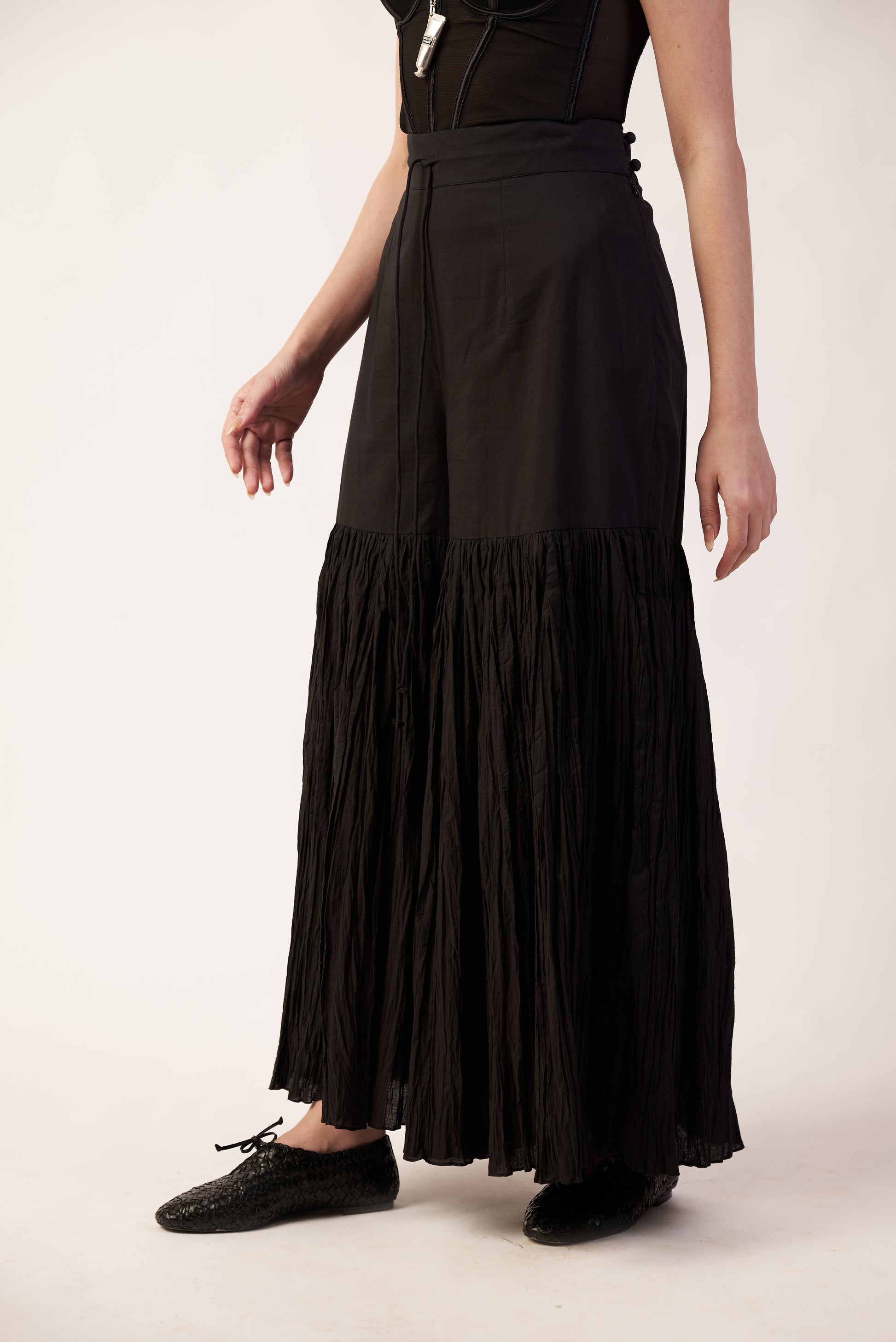 Black tiered pant worn by a person  | Women's Pants | Bottoms | Pret Clothes | nEo Clothes.
