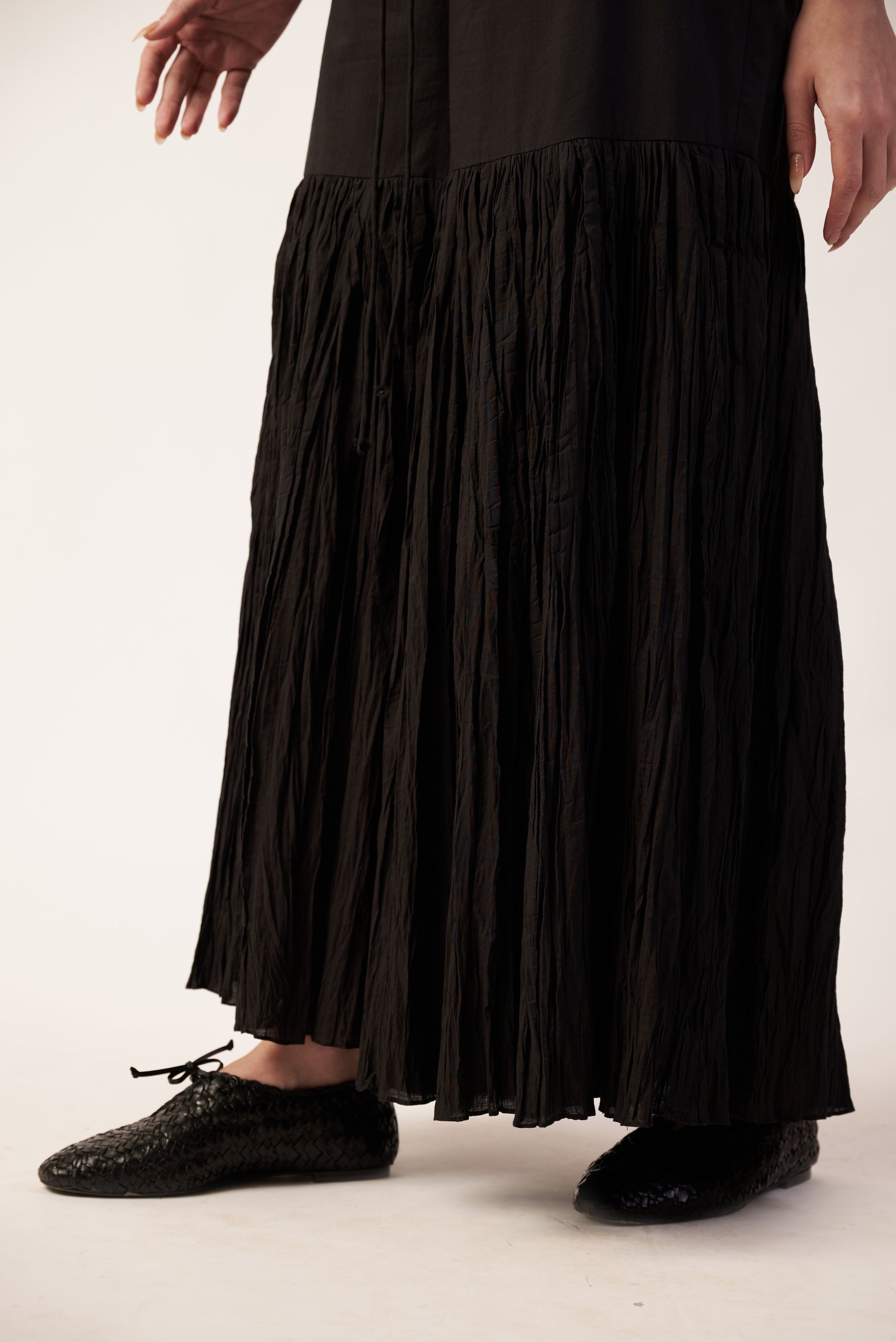 Person wearing a black pant and black shoes  | Women's Pants | Bottoms | Pret Clothes | nEo Clothes.d