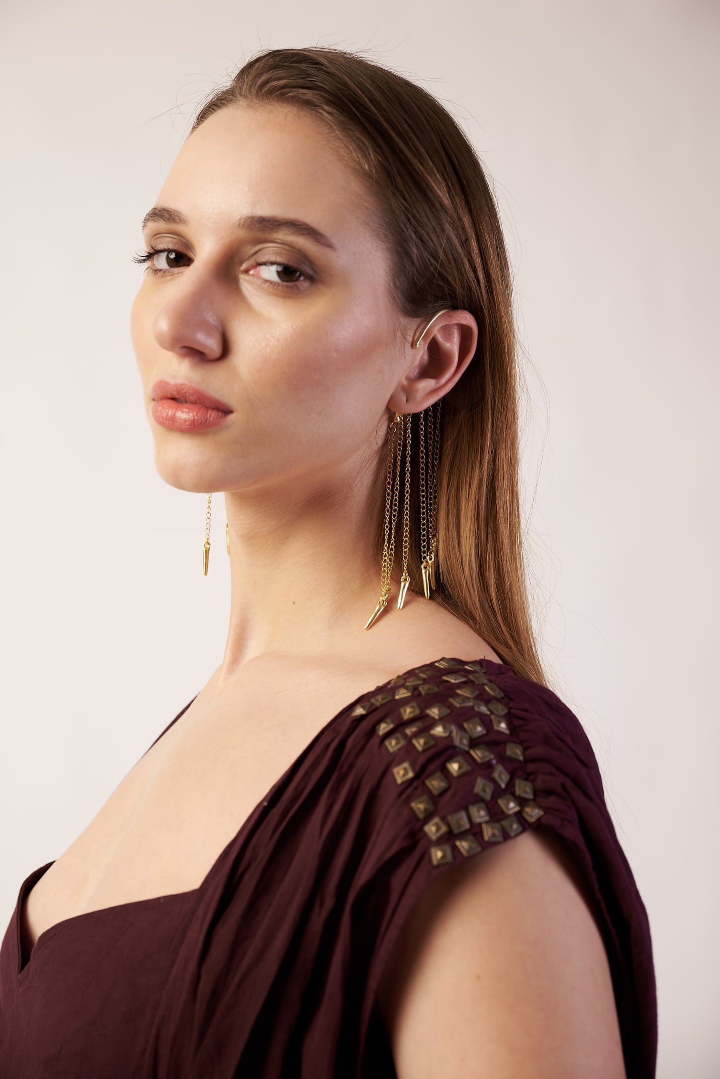 Woman wearing a Gold Ear Cuffs Earrings with coca cola camisole with embellishments | Statement Ear Cuffs | neo jewelry 